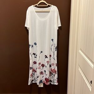 NWOT White maxi dress with flowers across the bottom. Short sleeves